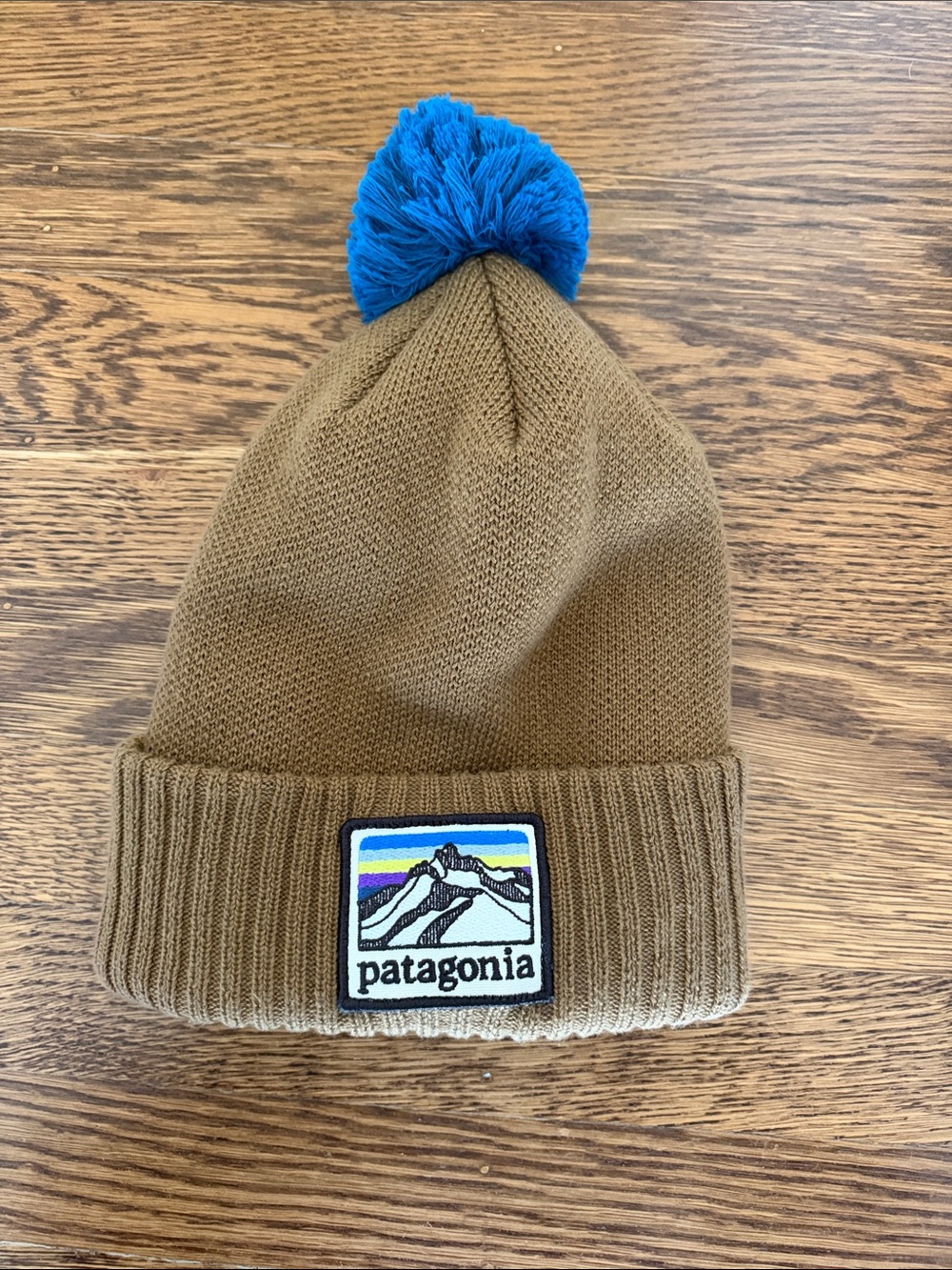Patagonia Caramel Beanie with Bright Blue Pom